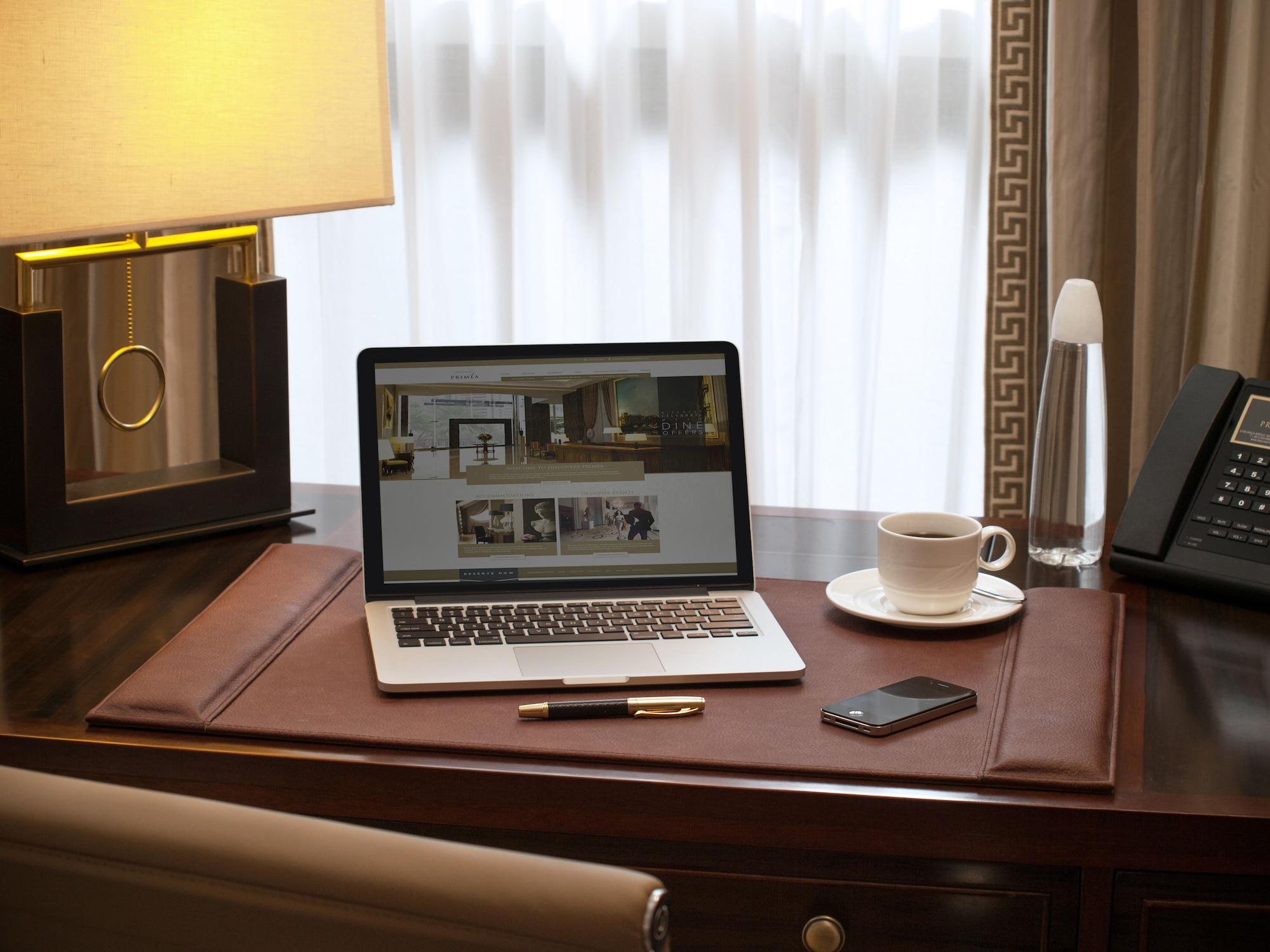 Discovery Primea Makati City Exterior photo A leather desk pad
